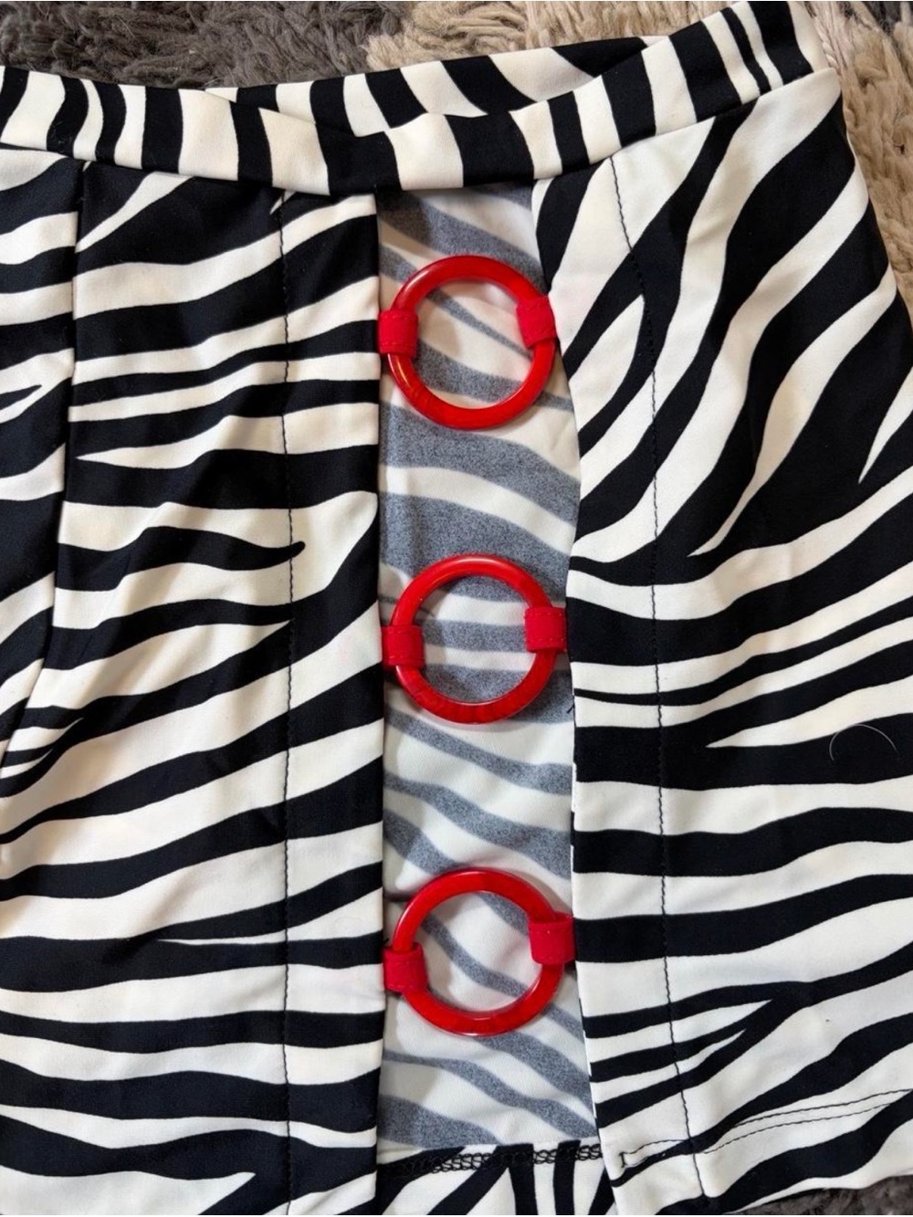 Zebra Print Mini Skirt with Red Accent Rings - Picture 2 of 5